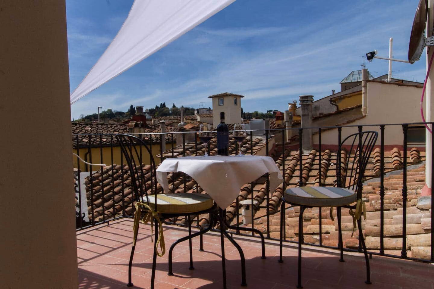 Private roof terrace set among the tiled rooftops of central Florence — La Croce D'Oro